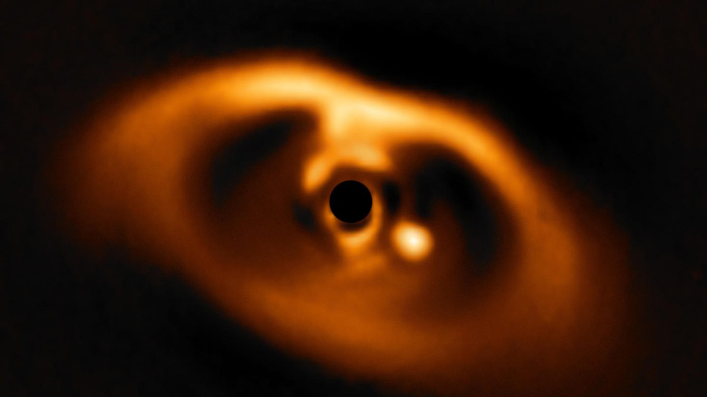 The photo provided by the European Southern Observatory ESO taken from the SPHERE instrument on ESO's Very Large Telescope is the first clear image of a planet caught in the very act of formation around the dwarf star PDS 70. (AP)